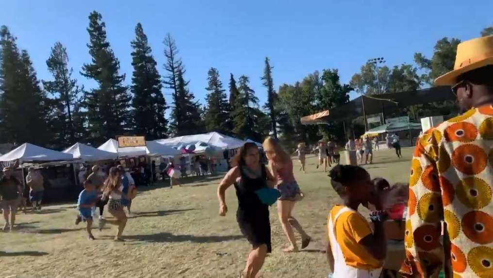 People run as an active shooter was reported at the Gilroy Garlic Festival, south of San Jose, California, U.S., July 28, 2019 in this still image taken from a social media video. Courtesy of Twitter @wavyia/Social Media via REUTERS. ATTENTION EDITORS - THIS IMAGE HAS BEEN SUPPLIED BY A THIRD PARTY. MANDATORY CREDIT @wavyia. NO RESALES. NO ARCHIVES.