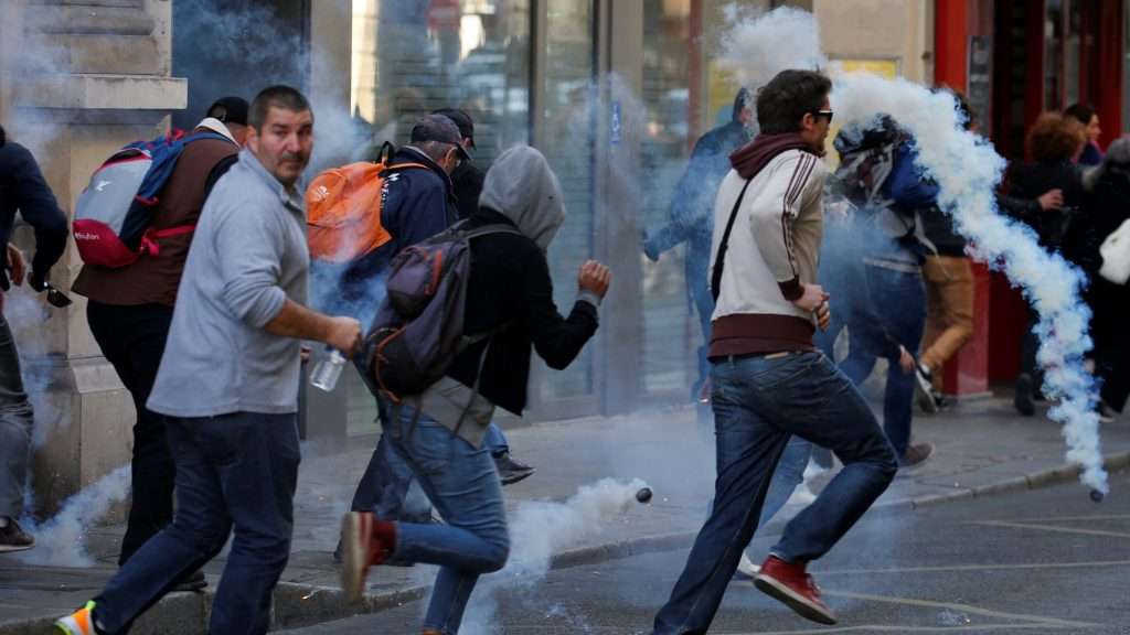 Protesters run away from tear gas canisters during a demonstration on Act 45 (the 45th consecutive national protest on Saturday) of the yellow vests movement in Paris, France, September 21, 2019. REUTERS/Pascal Rossignol