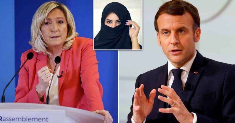 Macron Clashes with Le Pen over Veil Ban